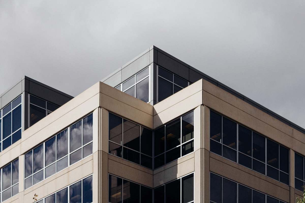 office building white concrete building during daytime architecture
